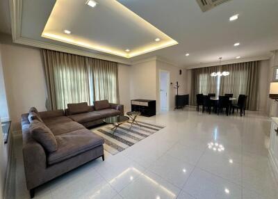 Modern living room with sectional sofa and dining area