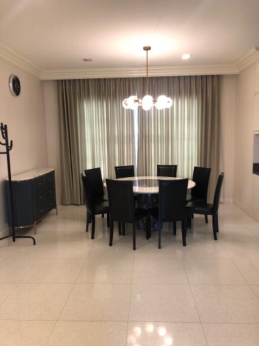 Modern dining room with black chairs and a round table