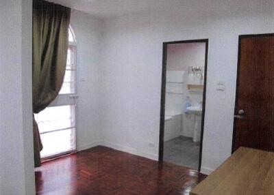 Bedroom with window and bathroom view