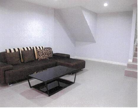 Modern living room with sectional sofa and glass coffee table