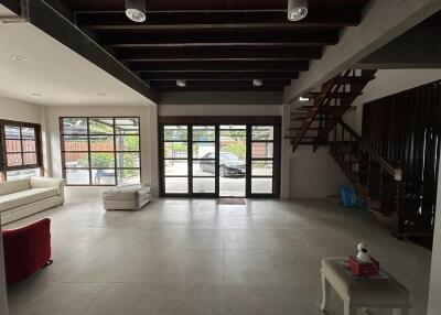 Spacious living room with large windows and modern decor