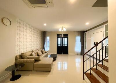 Spacious living room with modern decor and natural light