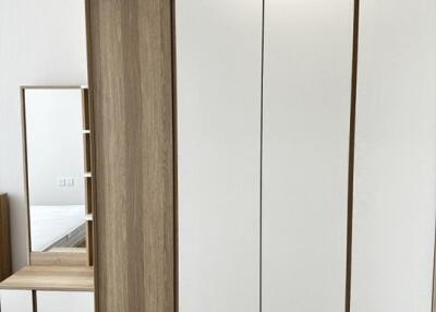 Modern bedroom with wardrobe and mirror