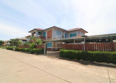 Two-story house with a gated entrance