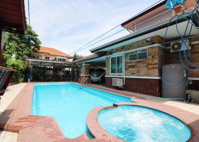 Outdoor area with a swimming pool and spa