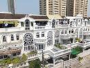 Exterior view of a white multi-story residential building with intricate window designs