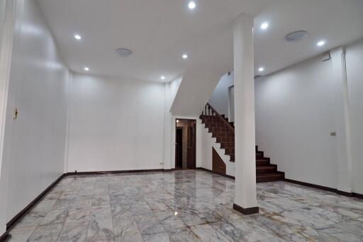 Spacious living area with staircase