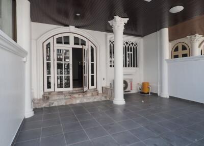 Front entrance with columns and tiled floor