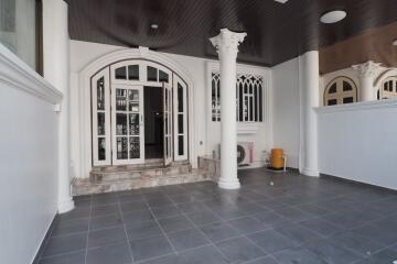 Front entrance with columns and tiled floor