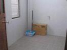 Empty small room with a window and boxes