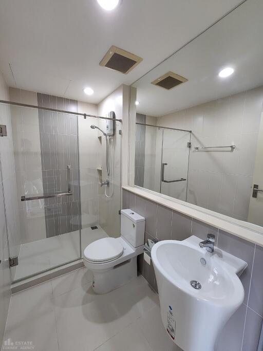 Modern Bathroom with glass shower enclosure and white fixtures