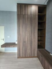 Bedroom with built-in wardrobe and shelving