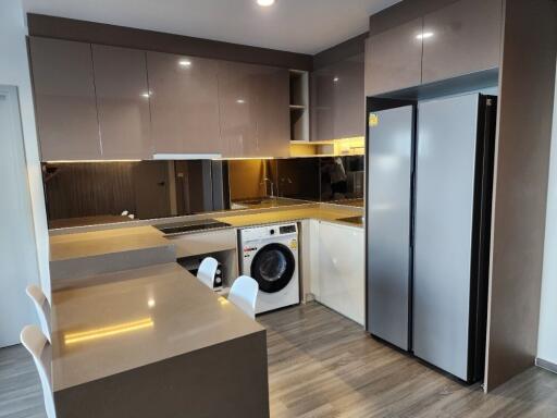 Modern kitchen with glossy cabinets and built-in appliances