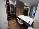 Modern bedroom with a study desk and built-in wooden wardrobe