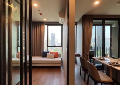 Modern living area with a view, including a dining table and a seating nook