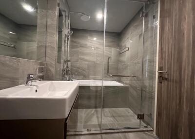 Modern bathroom with glass shower and bathtub