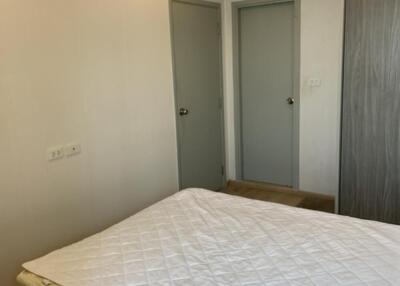 Bedroom with double bed, air conditioning unit and wardrobe