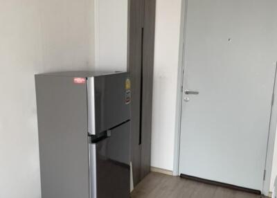 kitchen with refrigerator and door