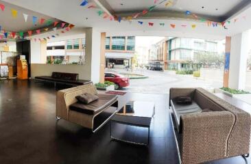 Spacious lobby area with modern seating and festive decor