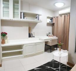 Spacious bedroom with a built-in study desk and shelves