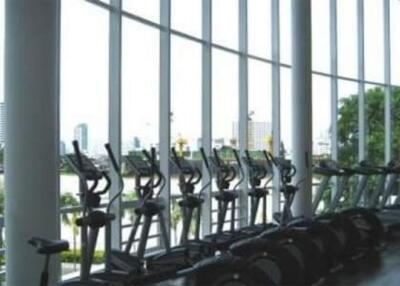 Well-equipped gym with a row of exercise bikes