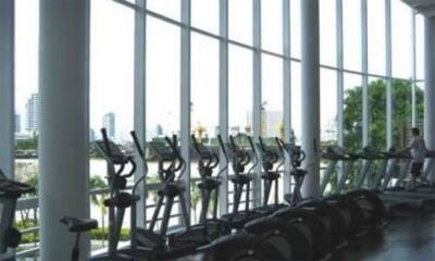 Well-equipped gym with a row of exercise bikes