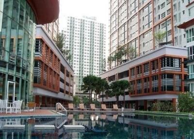 Modern apartment complex exterior with pool