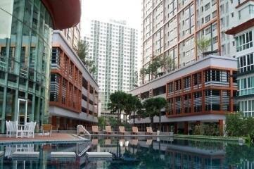 Modern apartment complex exterior with pool