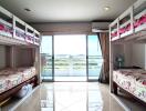 Spacious bedroom with bunk beds and balcony view