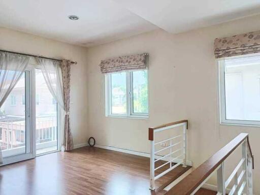 Bright living area with large windows and balcony