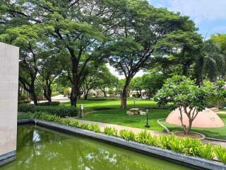 Beautiful outdoor space with trees and a reflective pond