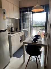 Modern kitchen and dining area with large window