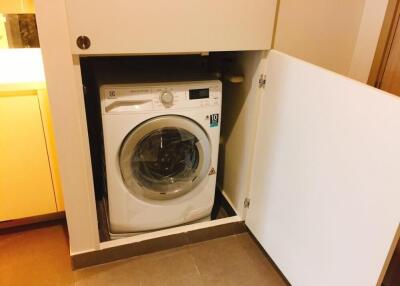 Washing machine in a small utility area