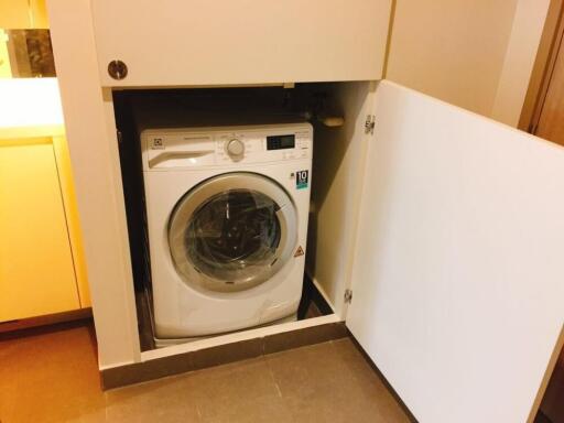 Washing machine in a small utility area