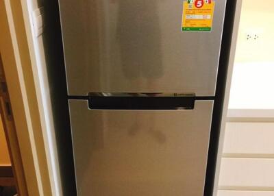 Modern refrigerator in a kitchen alcove