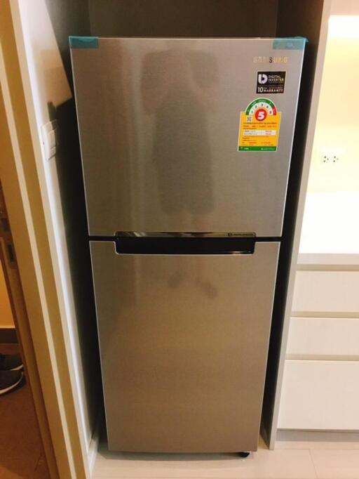 Modern refrigerator in a kitchen alcove