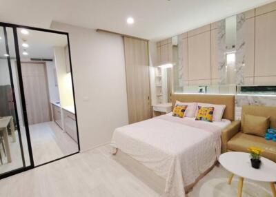 Modern bedroom with attached kitchenette