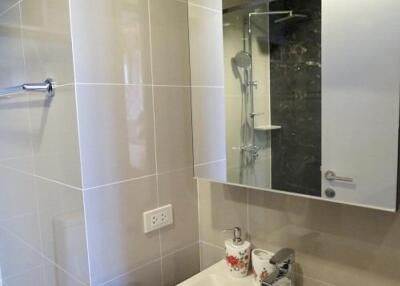 Modern bathroom with mirror and shower area