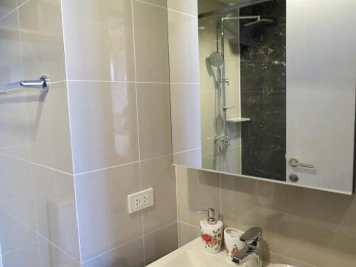 Modern bathroom with mirror and shower area