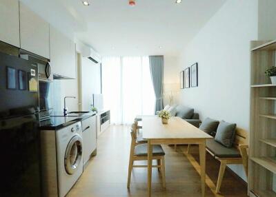 modern open-plan living room and kitchen area with dining space