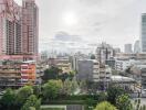 Cityscape view of various buildings and greenery in an urban area