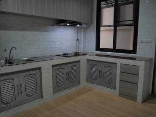 Modern kitchen with built-in cabinets and appliances