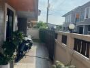 Front porch with plants and motorcycles