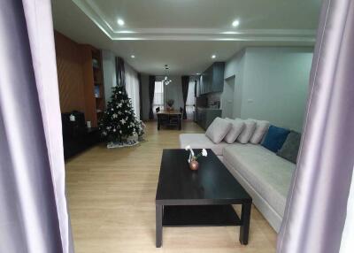 Spacious living and dining area with Christmas tree