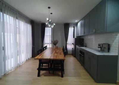 Modern kitchen with large dining table