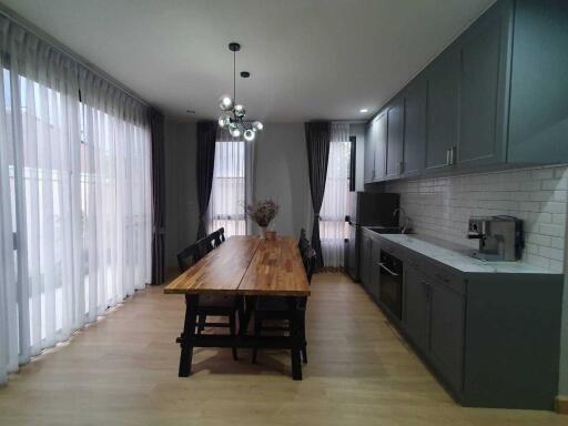 Modern kitchen with large dining table