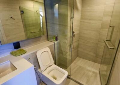 Modern bathroom with glass shower and stylish fixtures