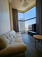 Living room with large windows and city view