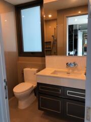 Modern bathroom with a large window, sink, and toilet