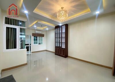 Spacious and well-lit living room with modern ceiling light